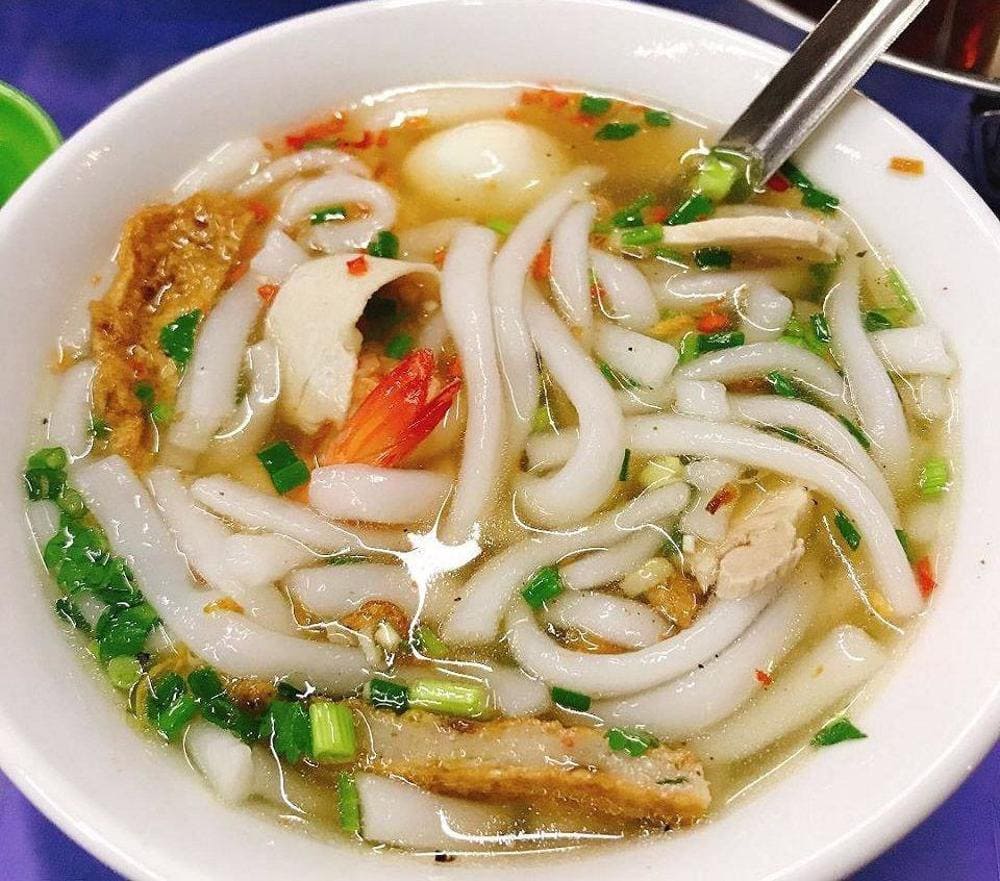 Thick tapioca noodles in rich broth with pork and fresh herbs